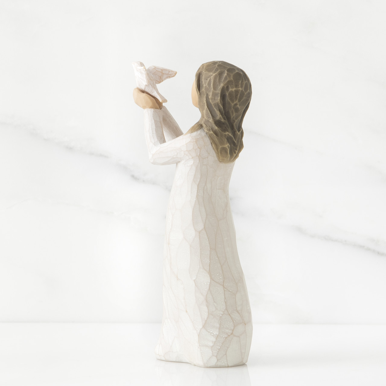 Soar sculpted figure by Susan Lordi