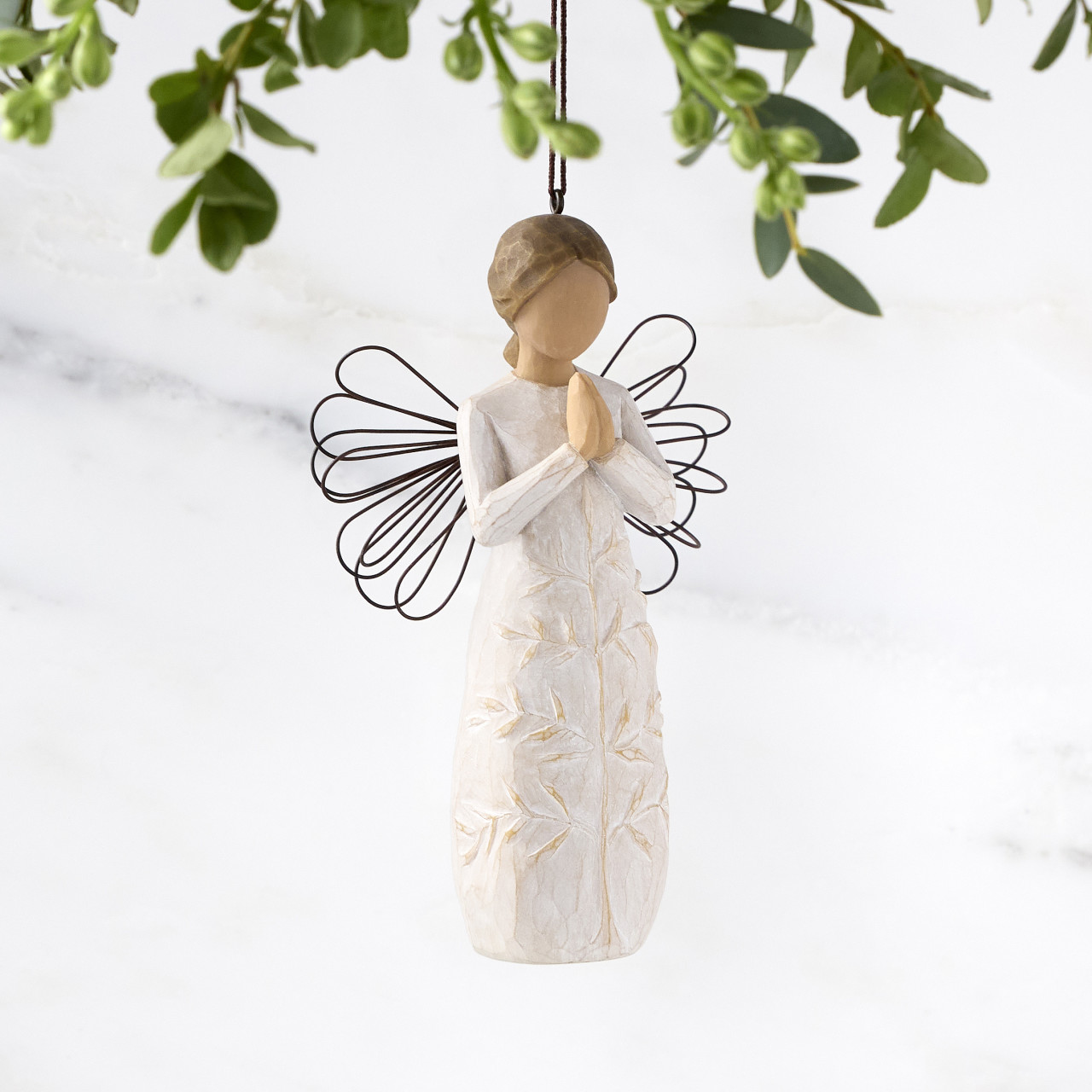 a tree, a prayer Ornament sculpted by Susan Lordi