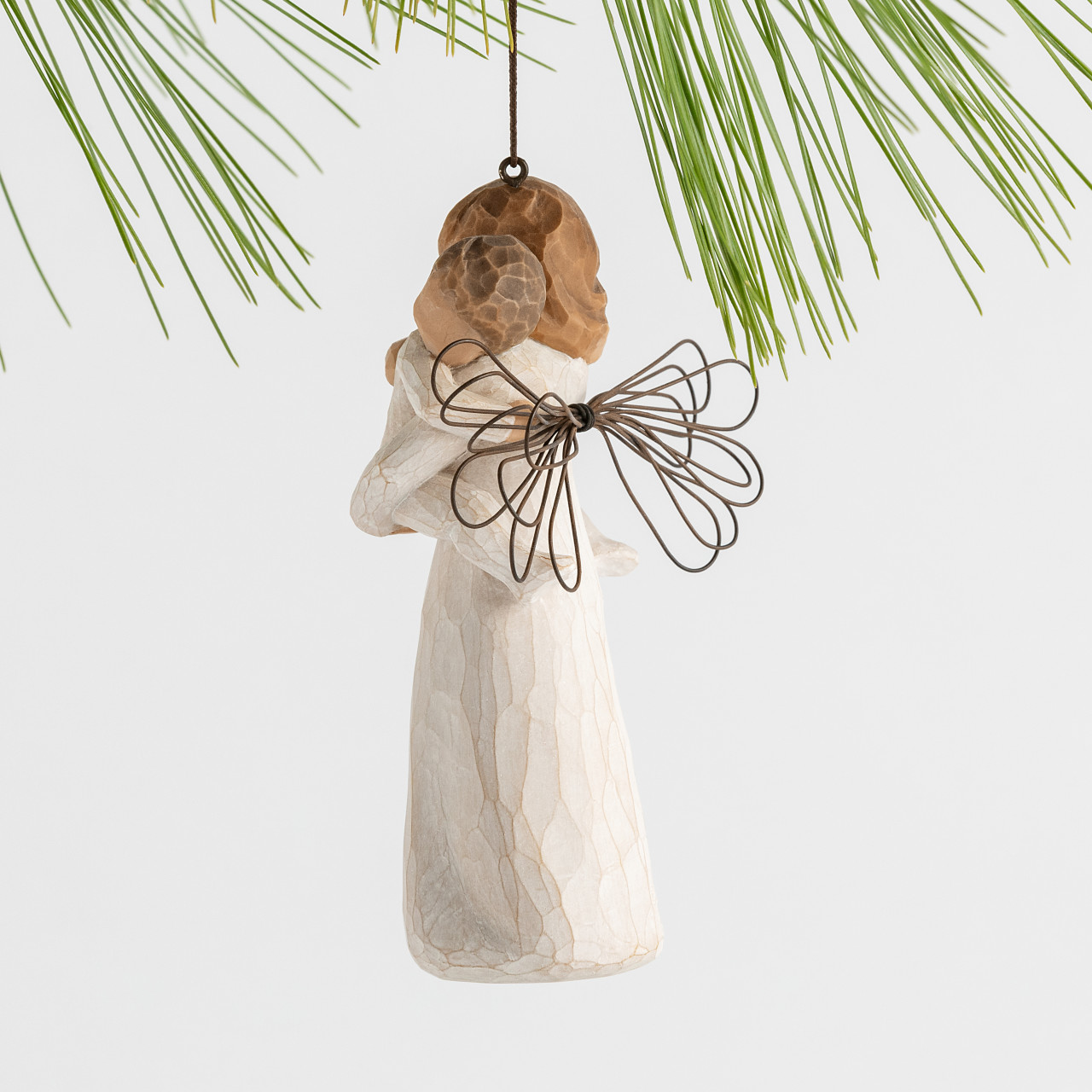 Angel's Embrace Ornament sculpted by Susan Lordi